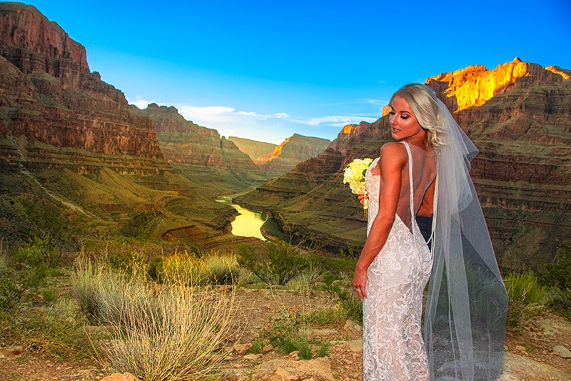 Bride at Grand Canyon rim helicopter wedding portrait