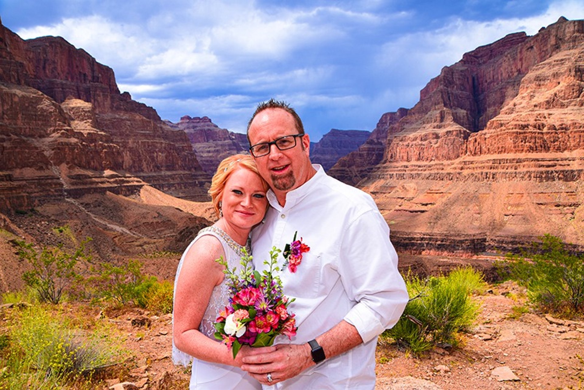Smiling couple at Grand Canyon helicopter wedding ceremony riverside
