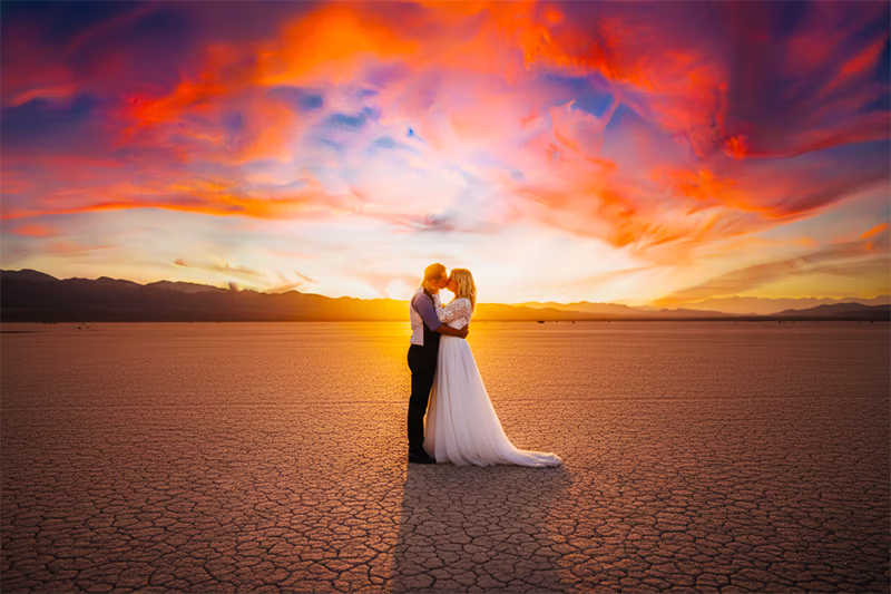 Newlyweds embracing at sunset Eldorado Dry Lakebed desert elopement Nevada