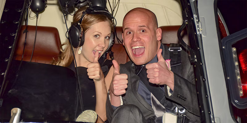 Happy couple giving thumbs up after Las Vegas helicopter wedding